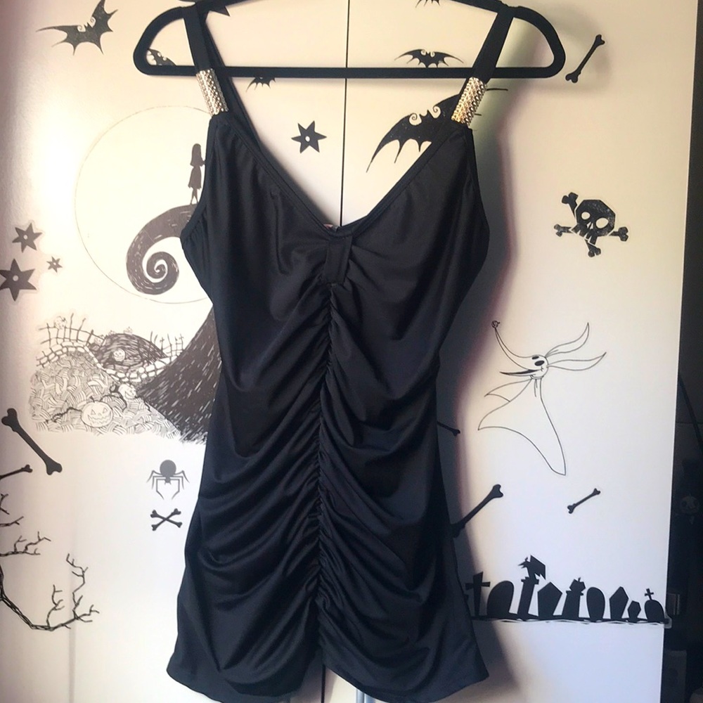 Black Top with silver accessory on straps